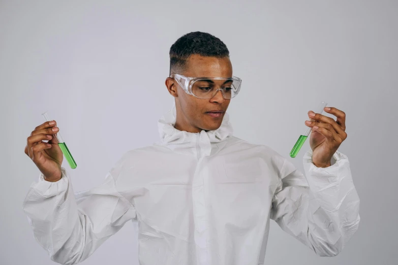 a man in a lab coat holding two test tubes, inspired by Ismail Gulgee, pexels contest winner, wearing green clothing, a teen biopunk cyborg, yung lean, gustavo fring