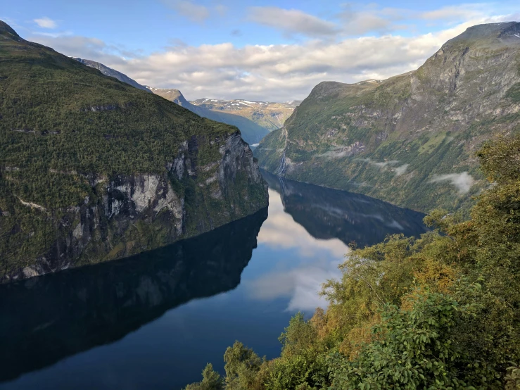 a large body of water surrounded by mountains, by Tom Wänerstrand, pexels contest winner, hurufiyya, alvar aalto, 2 5 6 x 2 5 6 pixels, steep cliffs, reflexions
