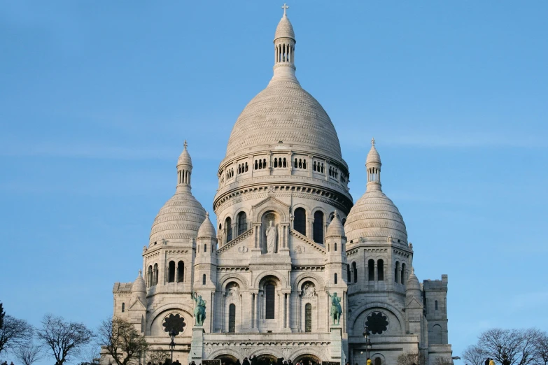 a large white building sitting on top of a lush green field, art nouveau, background basilica! sacre coeur, thumbnail, exterior, 3 doors