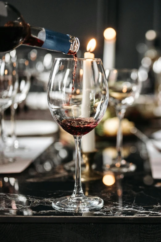 a person pouring wine into a wine glass, at a dinner table, premium quality, multiple stories, scarlet