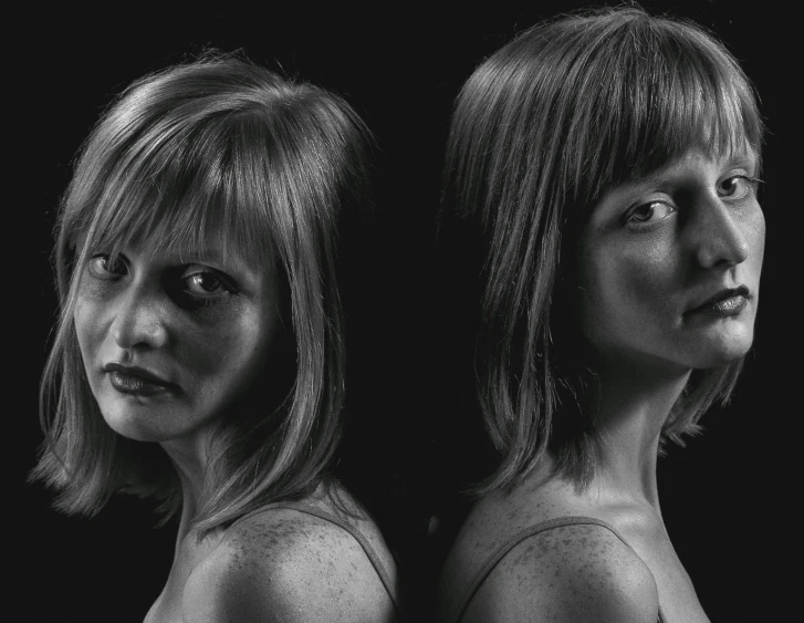 a couple of women standing next to each other, a black and white photo, inspired by Cindy Sherman, pixabay, hyperrealism, studio!! portrait lighting, front and back, mirrored, angry complexion