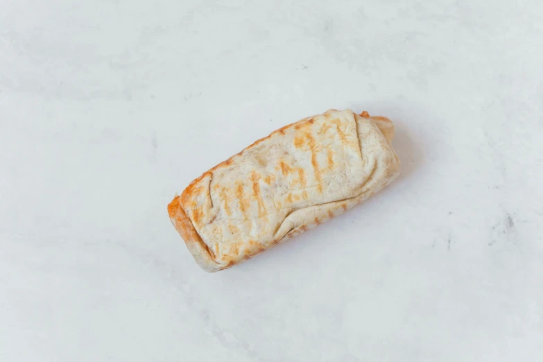 a sandwich sitting on top of a white counter, wrapped, marble white complexion, detailed product image, kebab