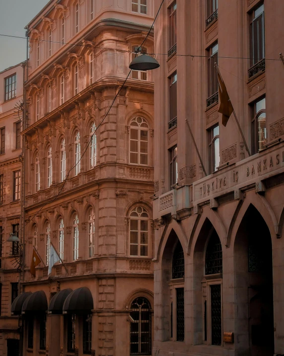 a couple of buildings that are next to each other, a photo, pexels contest winner, renaissance, brown, thumbnail, low quality photo, lgbtq