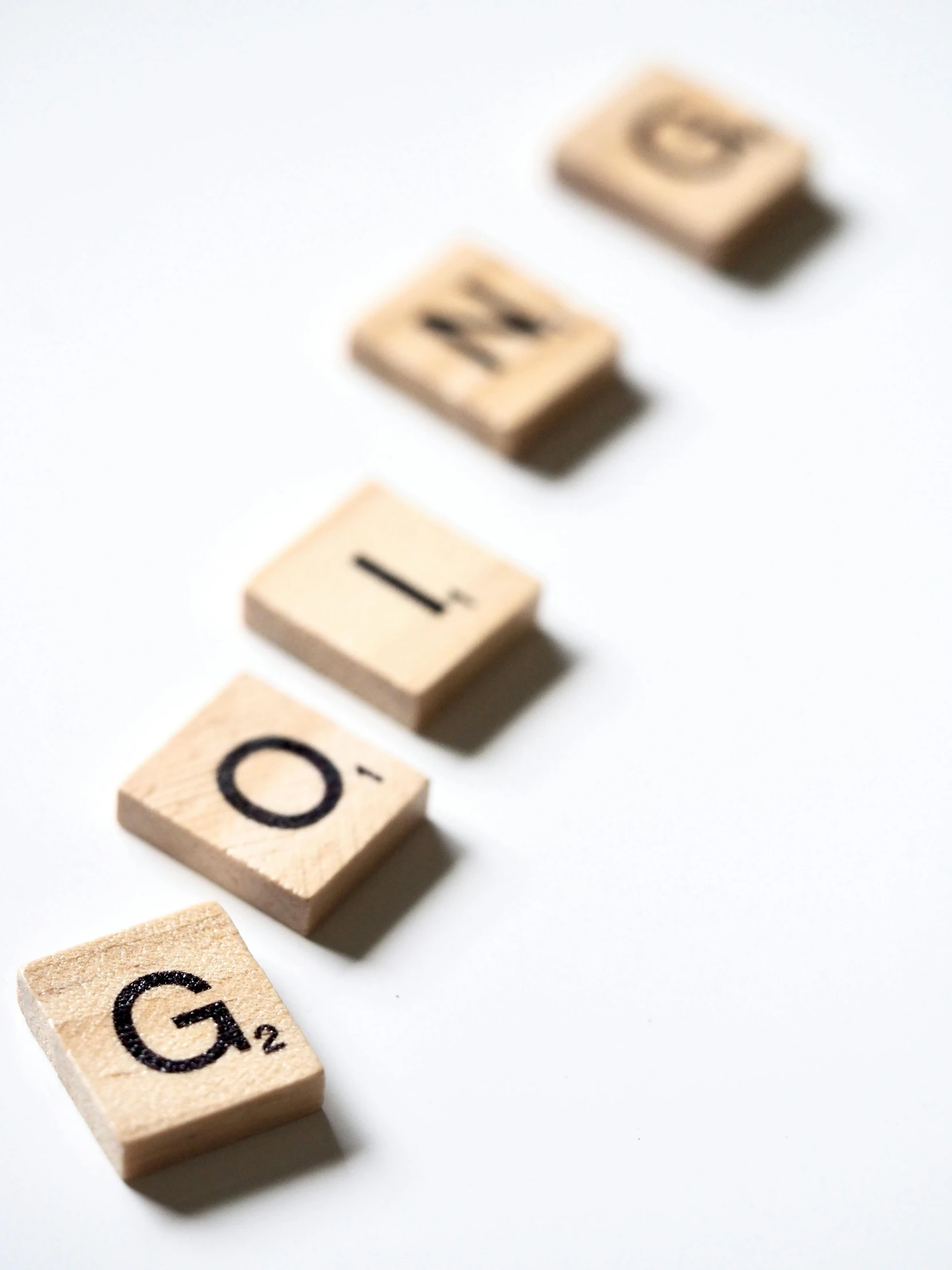 the word blog spelled in scrabbles on a white surface, by Georgina Hunt, unsplash, letterism, for gq, made of wood, detail shot, gong