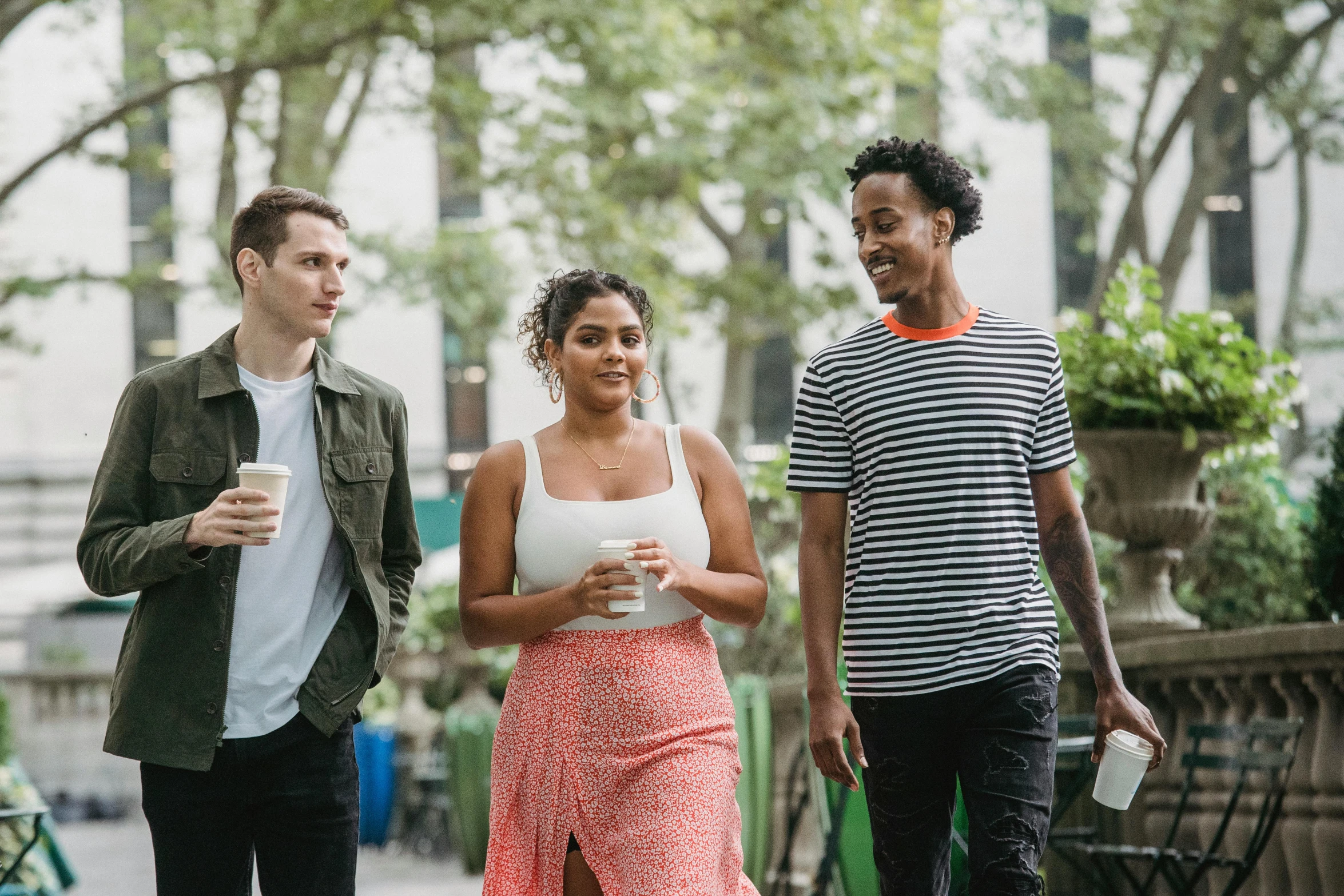 a group of people walking down a sidewalk, charli bowater and artgeem, in new york city, background image, young adult