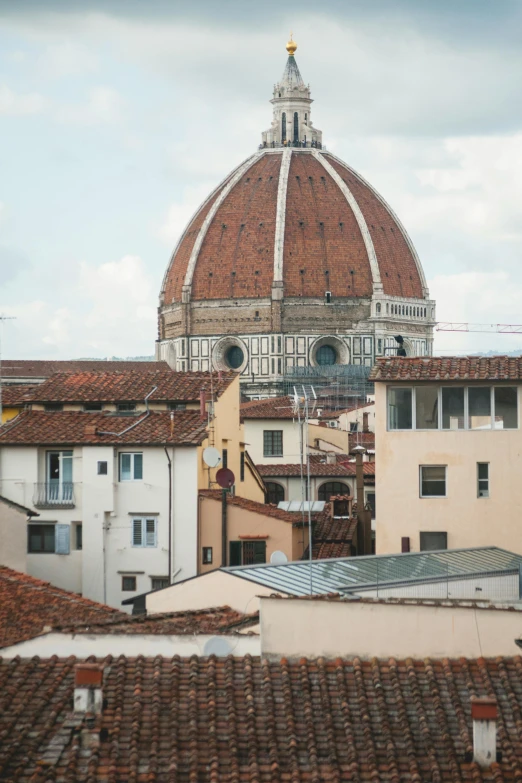 a view of a building with a dome in the background, inspired by Michelangelo Buonarotti, trending on unsplash, renaissance, florentine school, multiple stories, seen from far away, grain”