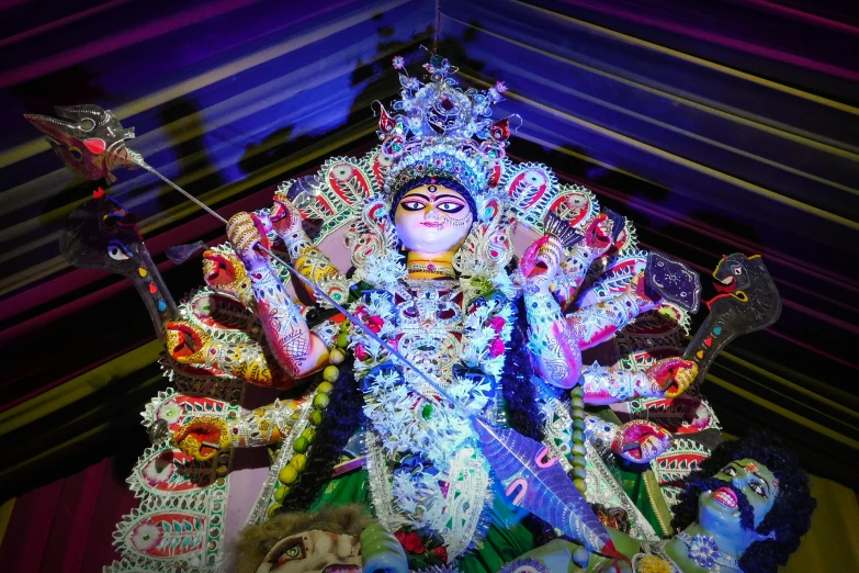 a close up of a statue of a woman, a statue, bengal school of art, with colourful intricate, summer festival night, avatar image