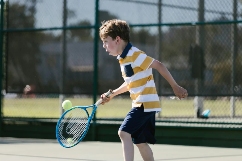 a young boy holding a tennis racquet on a tennis court, by Bertram Brooker, pexels contest winner, mid action, full frame image, various posed, 15081959 21121991 01012000 4k