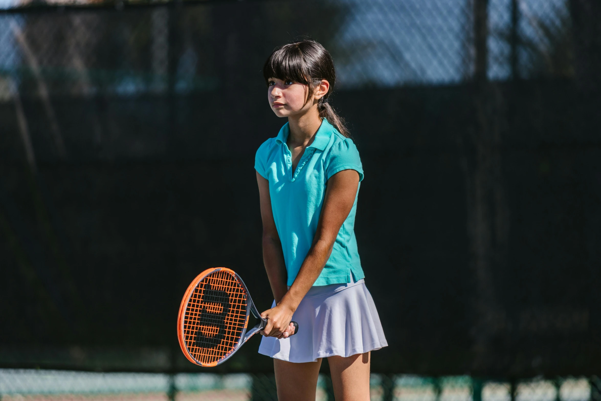 a young girl holding a tennis racquet on a tennis court, a portrait, unsplash, teal uniform, profile image, thumbnail, portrait n - 9