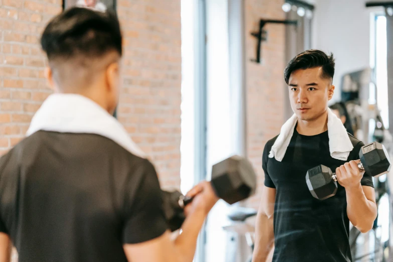 a man holding two dumbbells in a gym, pexels contest winner, jin shan and ross tran, angry at mirror, slightly minimal, mai anh tran