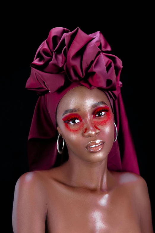 a woman with a turban on top of her head, an album cover, inspired by Chinwe Chukwuogo-Roy, trending on pexels, dark eye shadow, one eye red, full makup, red contacts