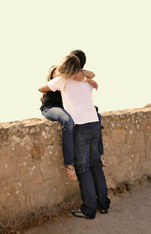 a couple of people sitting on top of a stone wall, hugging each other, 15081959 21121991 01012000 4k, teenager, fernando guerra