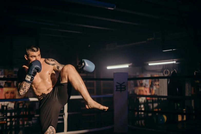 a man kicking a kick in a boxing ring, pexels contest winner, arabesque, zyzz, lachlan bailey, working out, bells