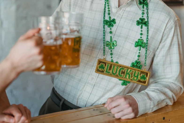 a man and a woman drinking beer at a bar, pexels contest winner, emerald tiara and necklace, four leaf clover, beware the ides of march, beads