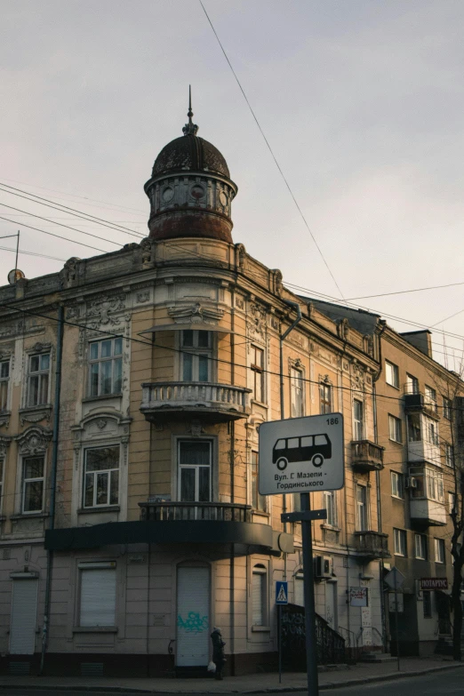 a tall building sitting on the side of a road, a photo, art nouveau, lviv historic centre, 2019 trending photo, trams ) ) ), square