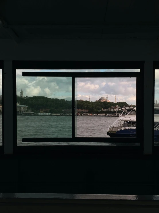 a boat that is sitting in the water, a matte painting, inspired by Thomas Struth, hyperrealism, istanbul, glass wall, trending on vsco, eyelevel perspective image