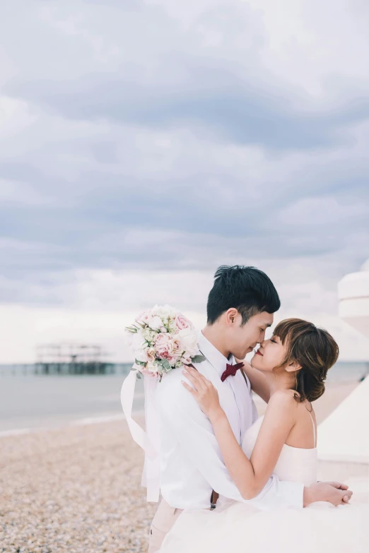 a bride and groom kissing on the beach, unsplash, ruan jia and fenghua zhong, square, london, seaview