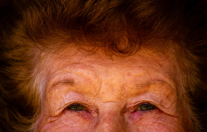 a close up of a woman with wrinkles on her face, an album cover, by Jan Rustem, unsplash, molly weasley, eyelids, wrinkles, taken in the late 2010s