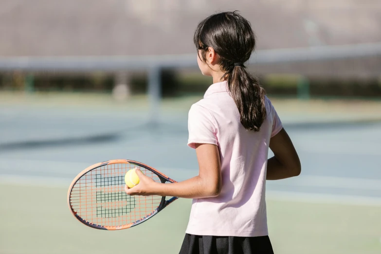a woman holding a tennis racquet on a tennis court, pexels contest winner, american barbizon school, girl wearing uniform, al fresco, from back, 15081959 21121991 01012000 4k