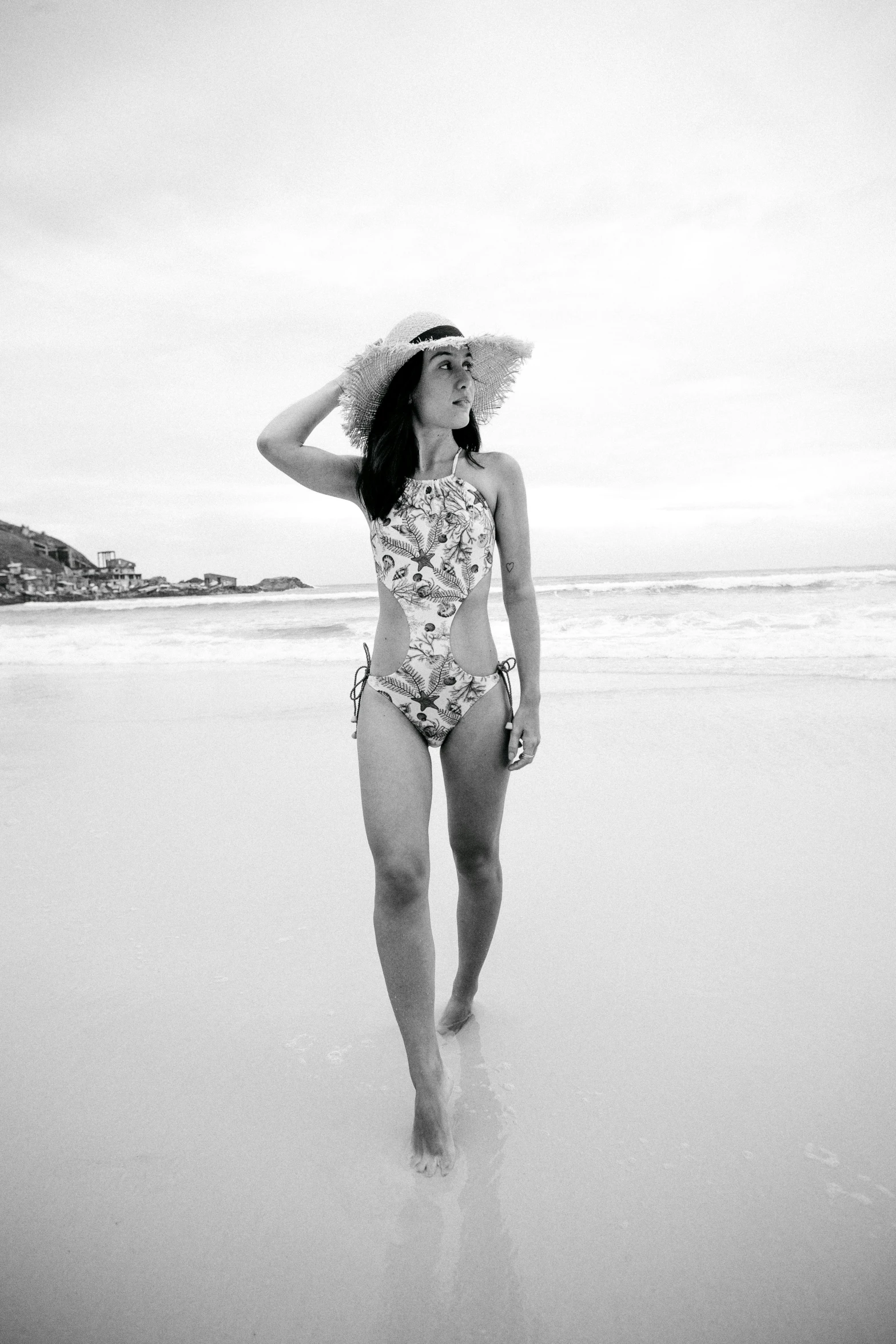 a woman standing on top of a beach next to the ocean, a black and white photo, nico robin, floral, -n 2, white background : 3