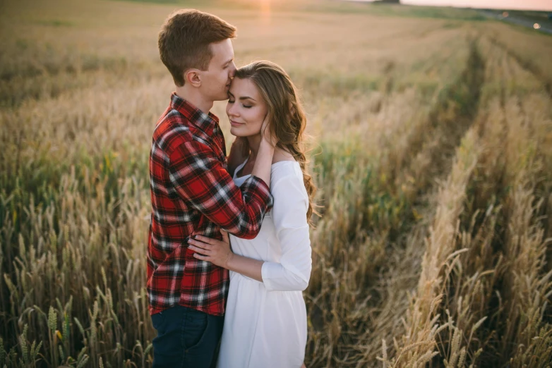 a man and woman standing in a wheat field, pexels contest winner, handsome girl, thumbnail, sweet hugs, owen klatte