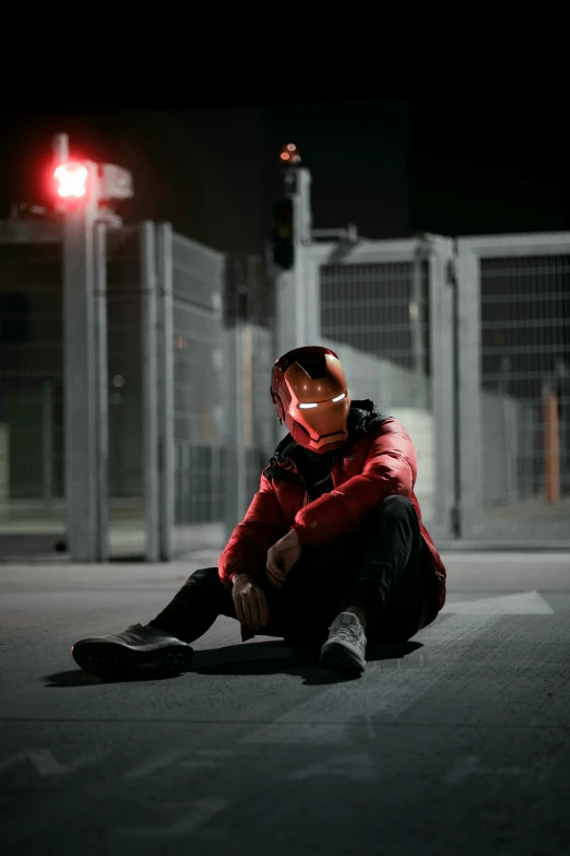 a person sitting on the ground at night, an album cover, inspired by Zhu Da, pexels contest winner, red hood cosplay, human staring blankly ahead, techwear, profile pic