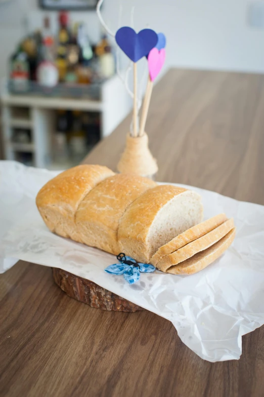 a loaf of bread sitting on top of a wooden table