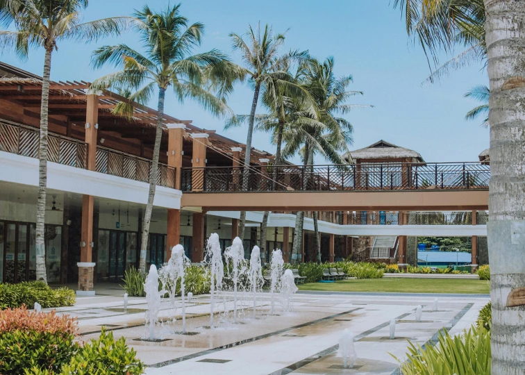 a courtyard with fountains and palm trees in the background, a portrait, unsplash, built around ocean, shopping mall, a wooden, schools