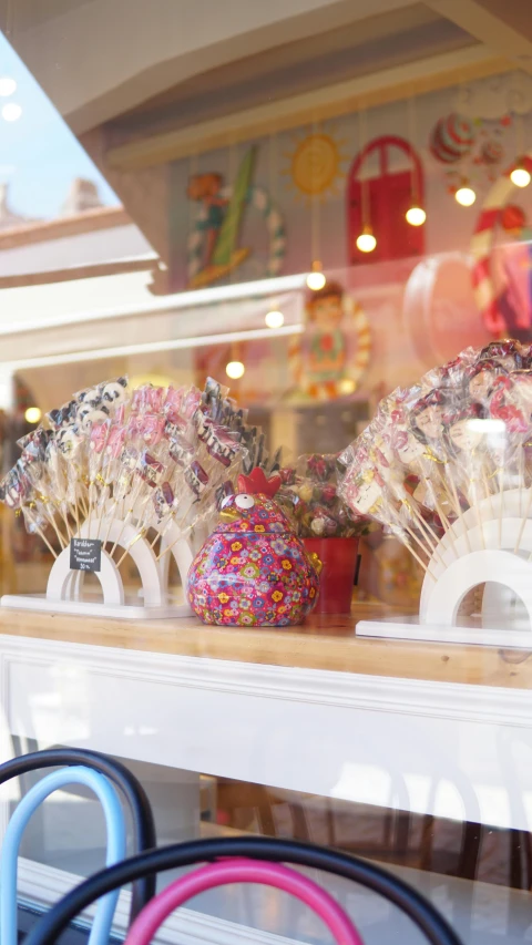 a store window filled with lots of lollipop lollipop lollipop lollipop lollipop lollipop lollipop, by Rachel Reckitt, pexels, art nouveau, square, hi-res, a small, a wooden