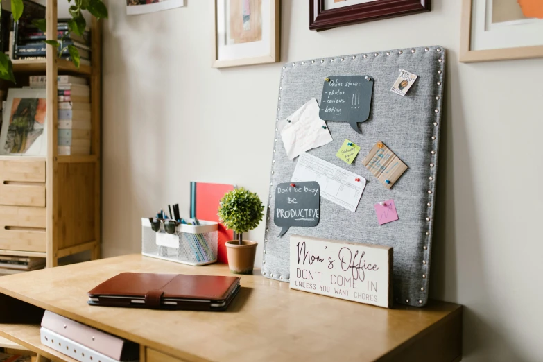 a bulletin board sitting on top of a wooden desk, trending on pexels, gray canvas, fully decorated, detailed product image, messages