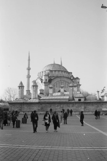 a black and white photo of people in front of a building, inspired by Altoon Sultan, hurufiyya, 2 5 6 x 2 5 6, dome, people walking around, monuments