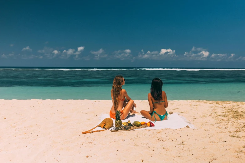 a couple of women sitting on top of a sandy beach, flat, moana, flatlay, profile image