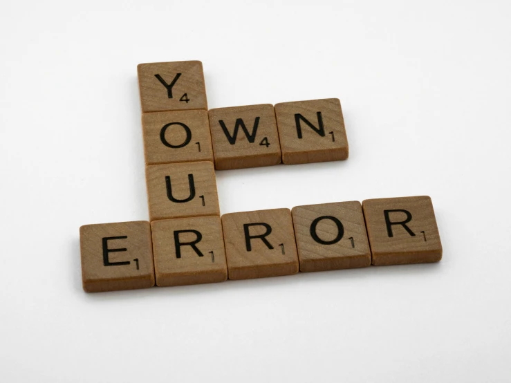 wooden scrabbles spelling your own error on a white surface, by Joe Bowler, pixabay, graffiti, square, y, grown up, 1 st winner