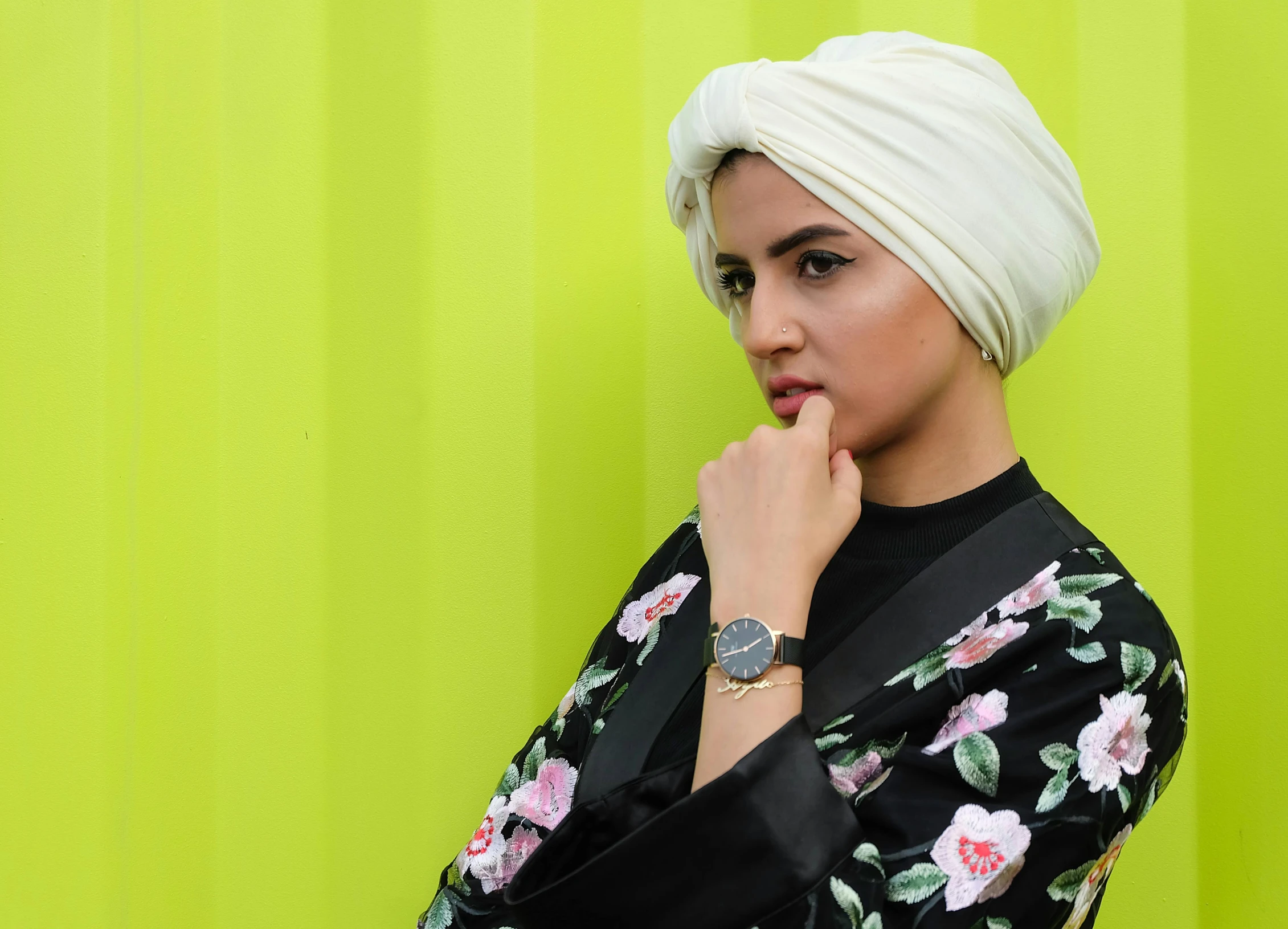 a woman in a turban poses for a picture, inspired by Manjit Bawa, trending on pexels, hurufiyya, wears a watch, fashion shoot 8k, wearing off - white style, arab ameera al-taweel