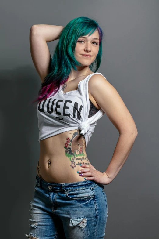 a woman with green hair posing for a picture, a tattoo, inspired by Jessie Alexandra Dick, wearing : tanktop, lovely queen, high resolution photo, age 2 0