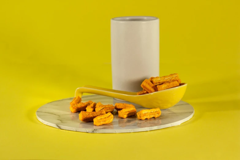 a can of chicken nuggies next to a bowl of chicken nuggies, an album cover, inspired by Sarah Lucas, unsplash, photorealism, holding a yellow toothbrush, cycladic sculptural style, orange subsurface scattering, hyperrealistic 3 d render