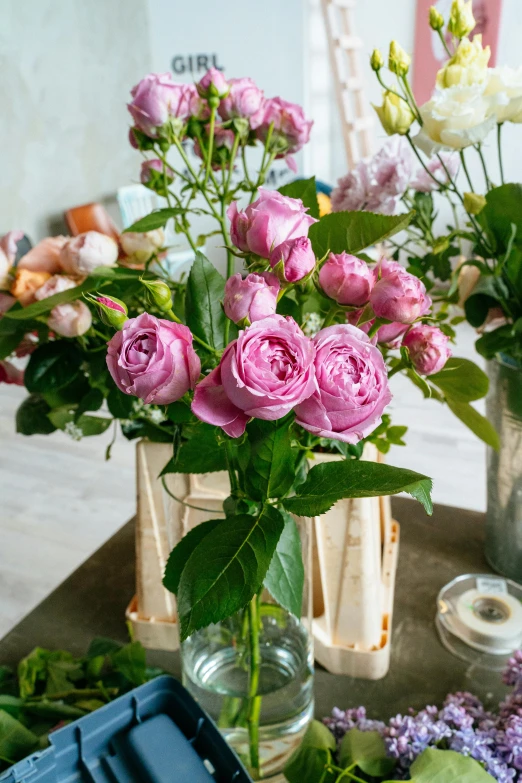 a table topped with vases filled with flowers, pink rose, handcrafted, commercially ready, fresh