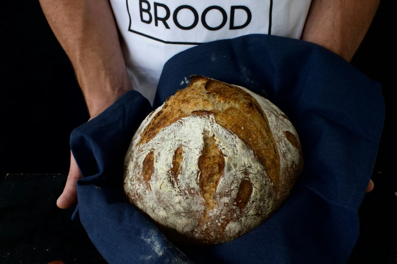 a man holding a loaf of bread in his hands, inspired by Richmond Barthé, featured on instagram, close up front view, brook, centred, cast