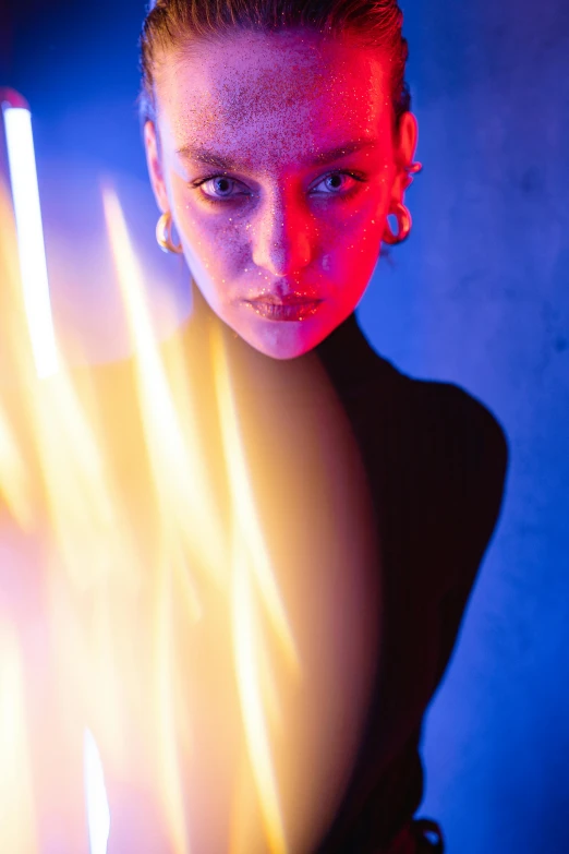 a woman standing in front of a neon light, a portrait, by Dan Luvisi, art photography, fire mage, close - up portrait shot, dramatic lighting - n 9, dasha taran