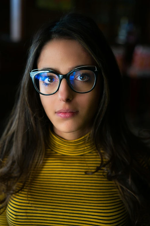 a close up of a person wearing glasses, by Julia Pishtar, beautiful iranian woman, full frame image, nerds, serious lighting