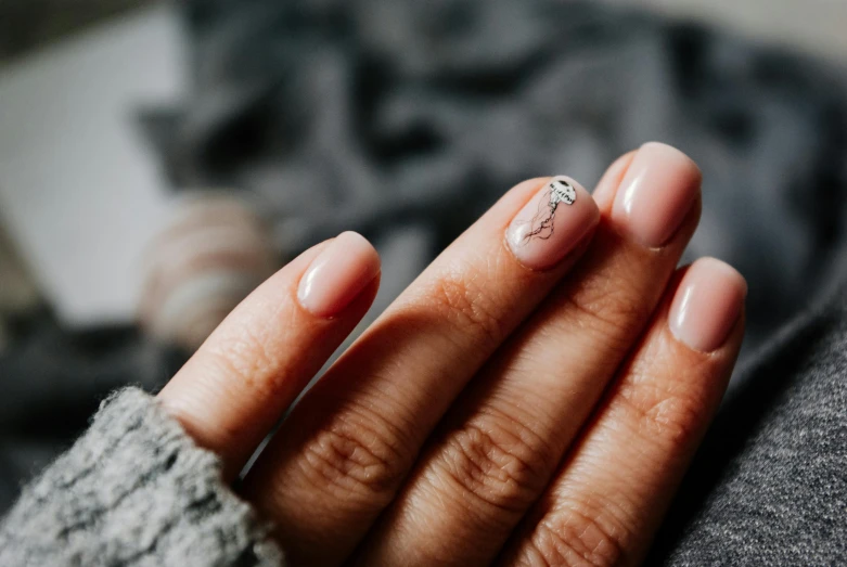 a close up of a person's hand with a ring on it, a photorealistic painting, trending on pexels, nail polish, cracked, manuka, minimalistic