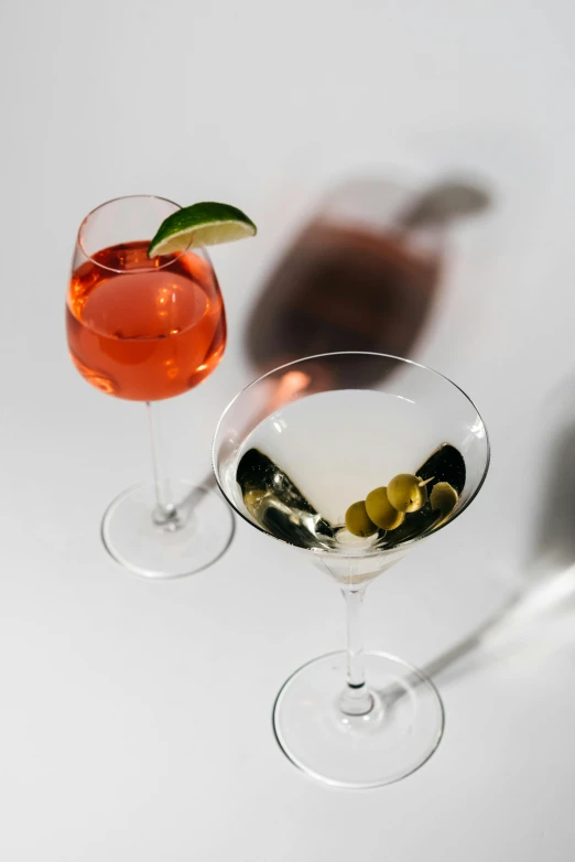 a couple of wine glasses sitting next to each other, by Ndoc Martini, daily specials, profile image, close angle, splento