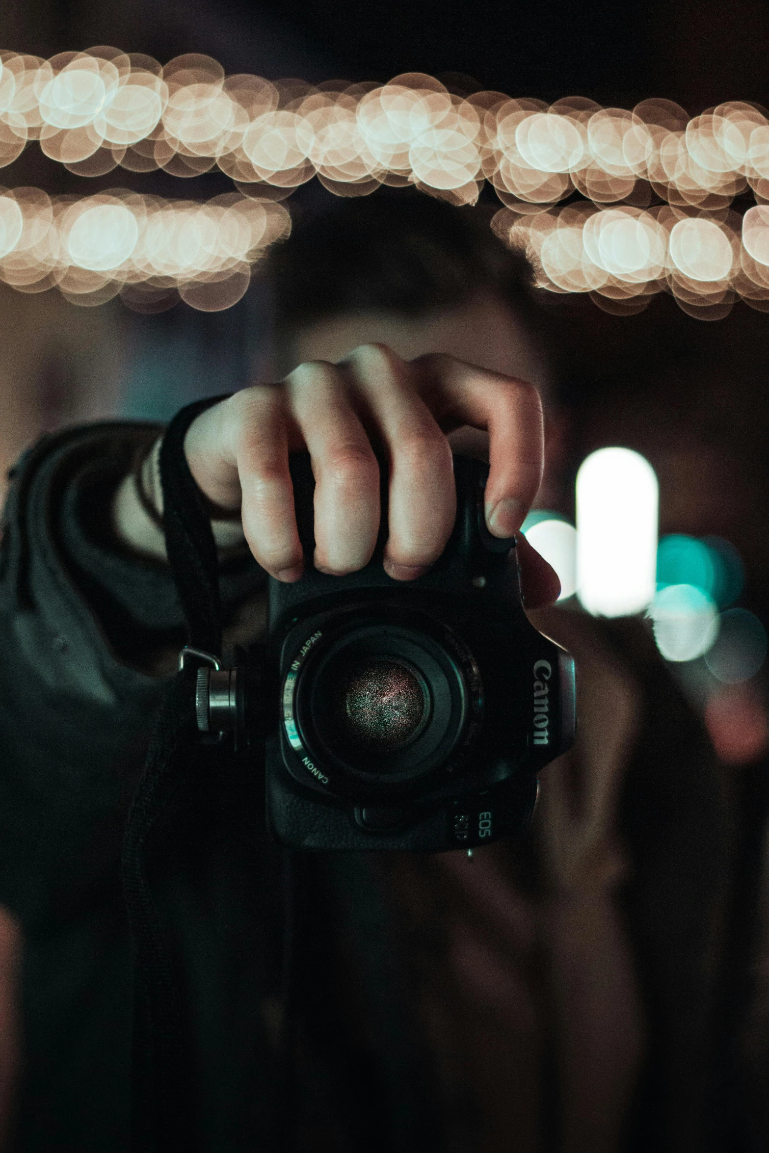 a person taking a picture with a camera, flashing lights, holding it out to the camera, sharply focused, 2019 trending photo