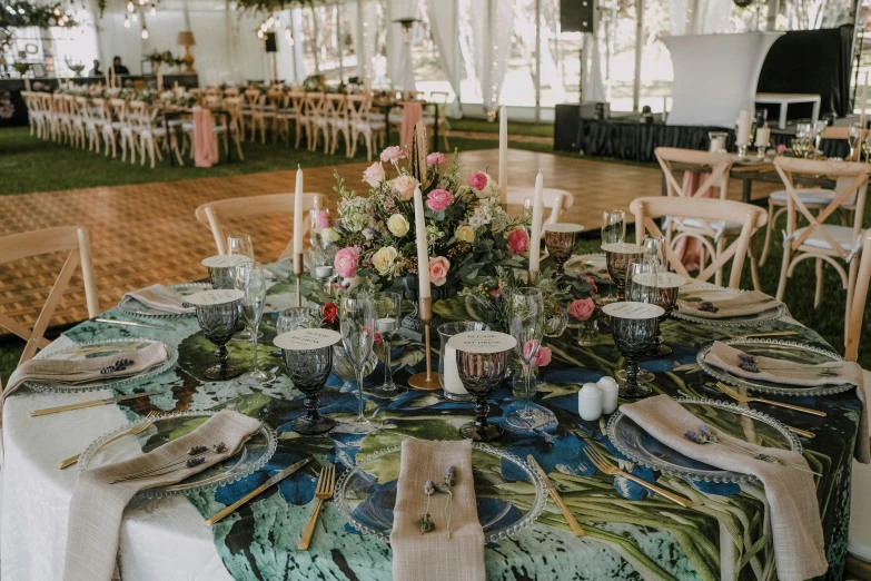 a table that has a bunch of place settings on it, by Emma Andijewska, pexels contest winner, interior of a tent, dressed in ornate, overlay, green and blue palette