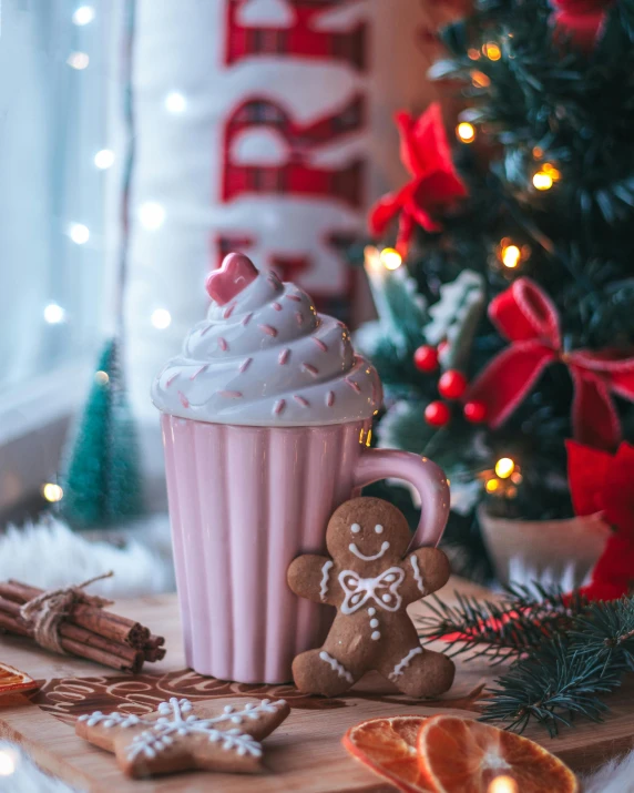 a cup of hot chocolate next to a christmas tree, by Julia Pishtar, trending on pexels, soft light 4 k in pink, 4k polymer clay food photography, milkshake, cupcake