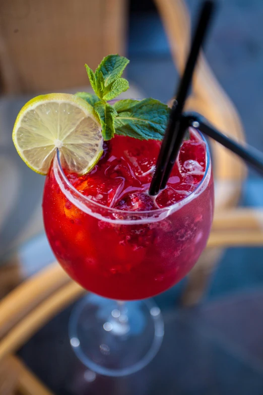 a red drink with a lime garnish garnish garnish garnish garnish garnish garnish ga, pexels contest winner, al fresco, manuka, multicoloured, maroon red