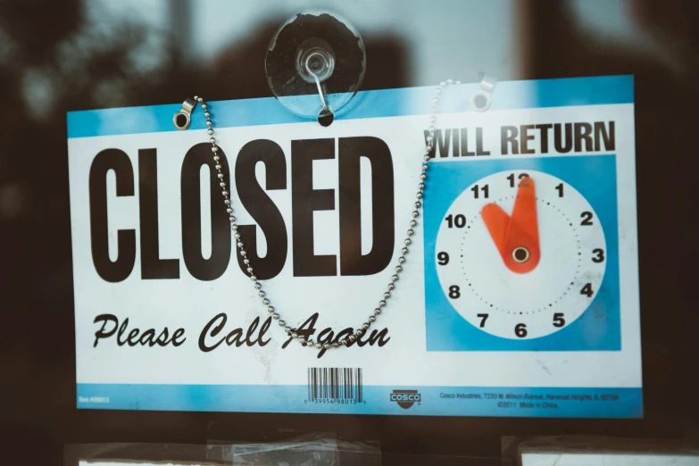 a close up of a sign with a clock on it, pexels, closed hands, stores, a labeled, restoration