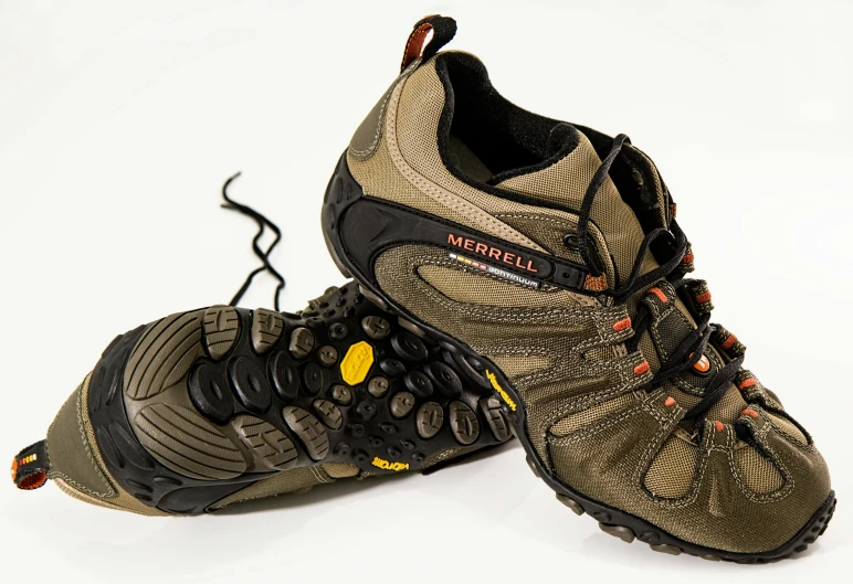 a pair of hiking shoes on a white surface, by Mirko Rački, trending on pixabay, vsx, michaelangelo style, spikes on the body, late 2000’s