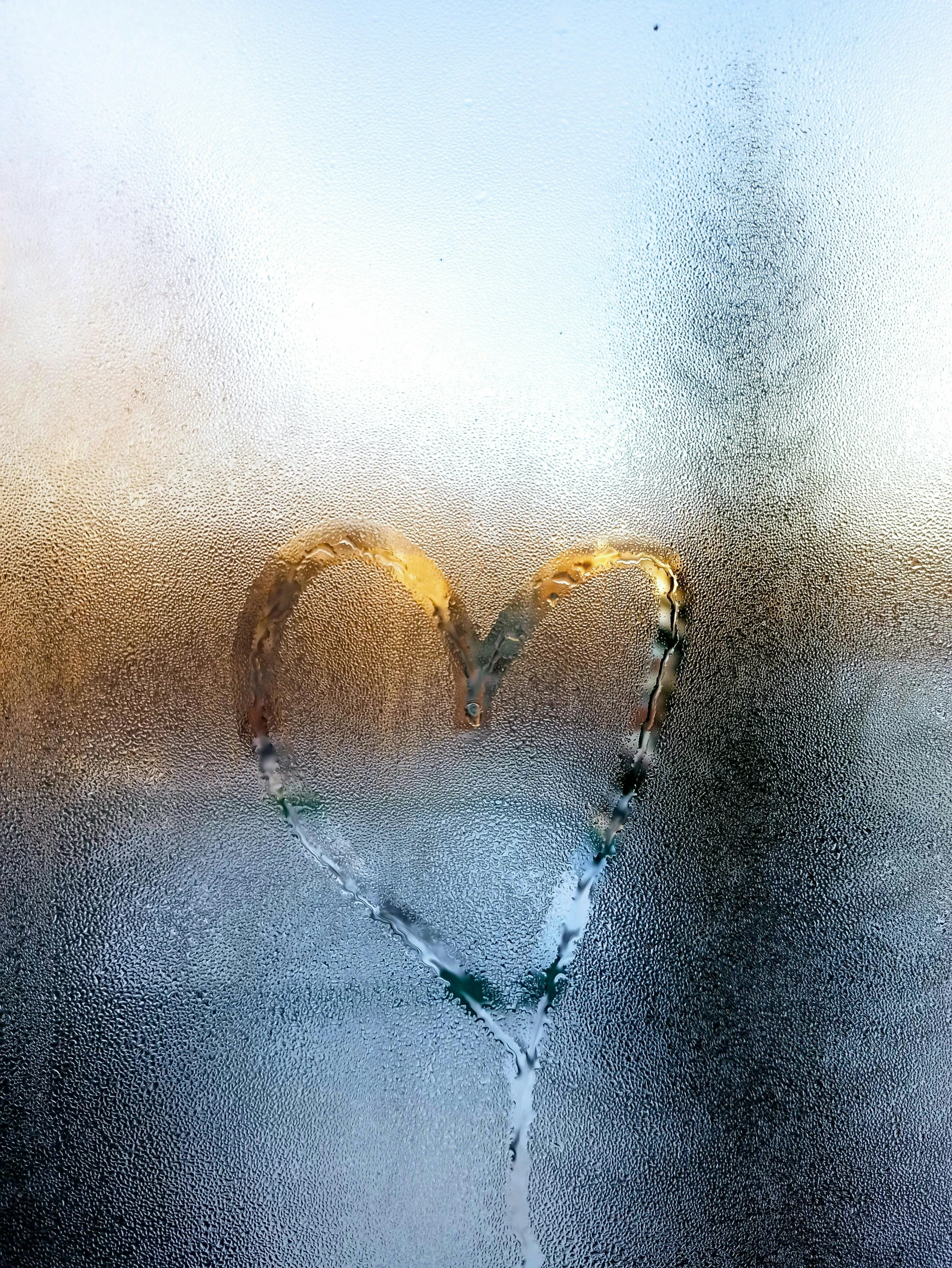 a heart drawn on the glass of a window, a picture, by Adam Marczyński, pexels contest winner, soft light of winter, golden linings, mixed art, hug