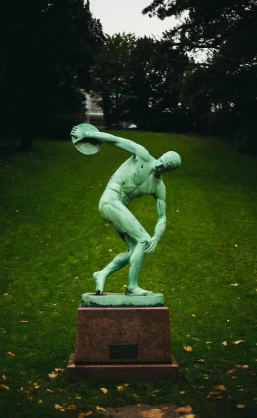 a statue of a man throwing a frisbee, by Heinrich Bichler, pexels contest winner, new sculpture, wearing track and field suit, melancholy, green body, olympics event 1930's